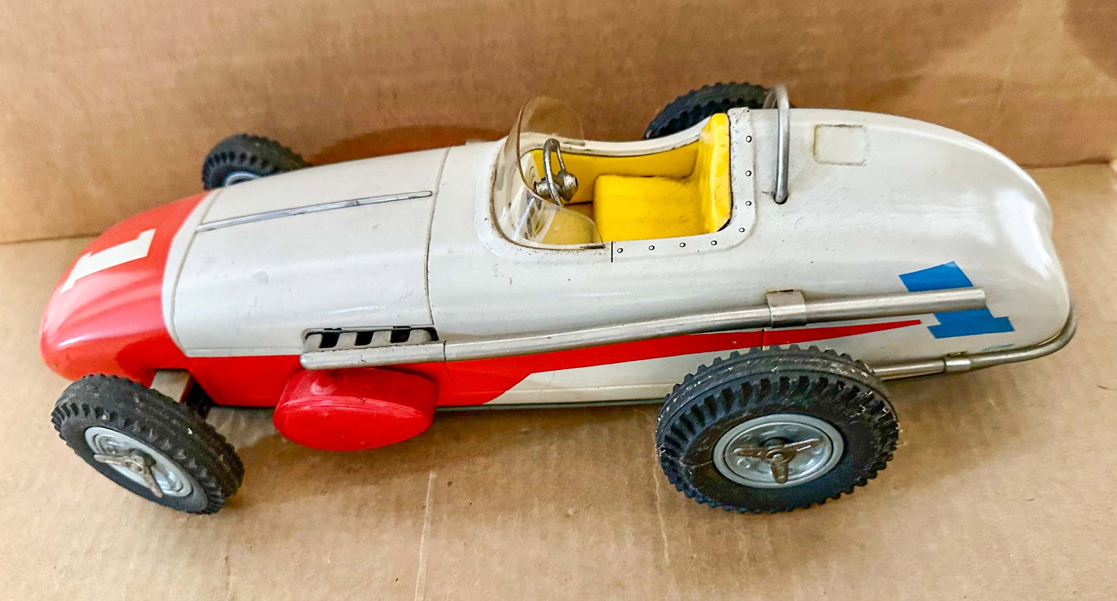 Toy Race Car: 1950's Yonezawa Indy 500 tin toy race car, has knock off dismountable wheels, 15 inches long.
