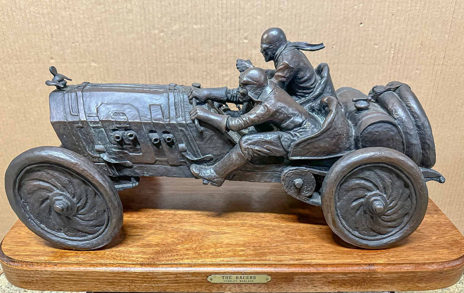 Stanly Wanlass Bronze: The Racers - cast bronze by Stanly Wanlass, mounted on walnut base, 65 pounds, 22 inches overall length.