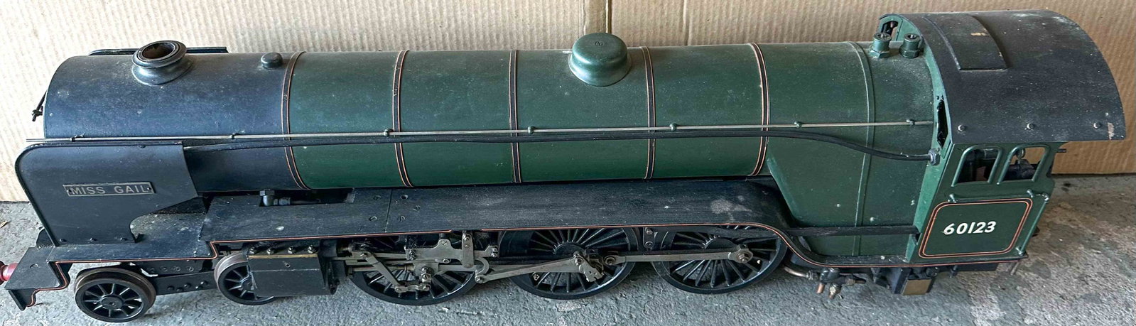 Steam Engine and Tender: Live steam train engine and tender, original patina, very detailed heavy construction, engine 36 inches long, tender 21 inches, total length 57 inches.
