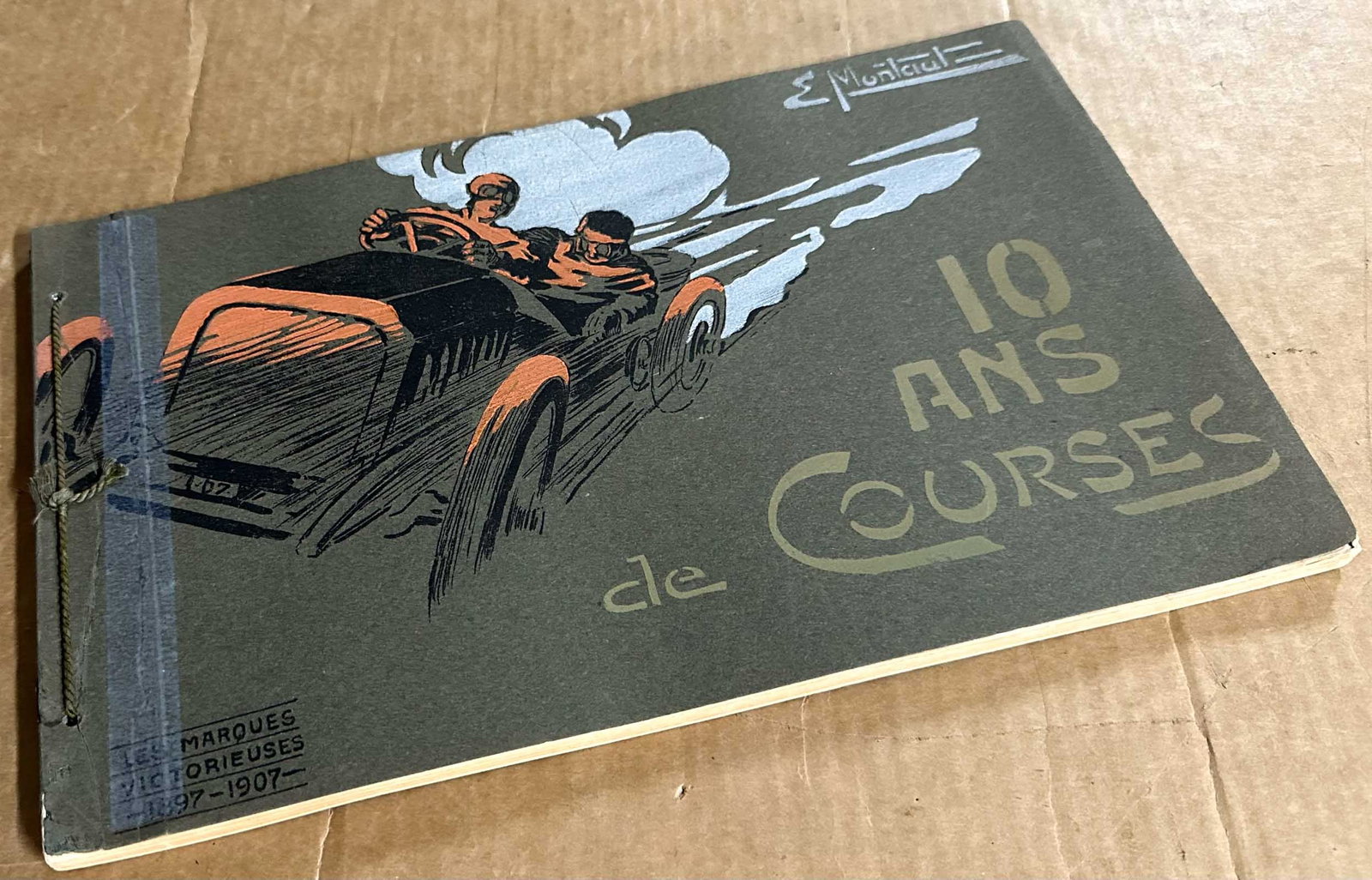 Misc. Lot: 10 Ans de Course string bound album of racing victories from 1897 - 1907, twenty eight color prints by E Montaut, each with tissue overlays with captions of each print, 13.5 x 8.