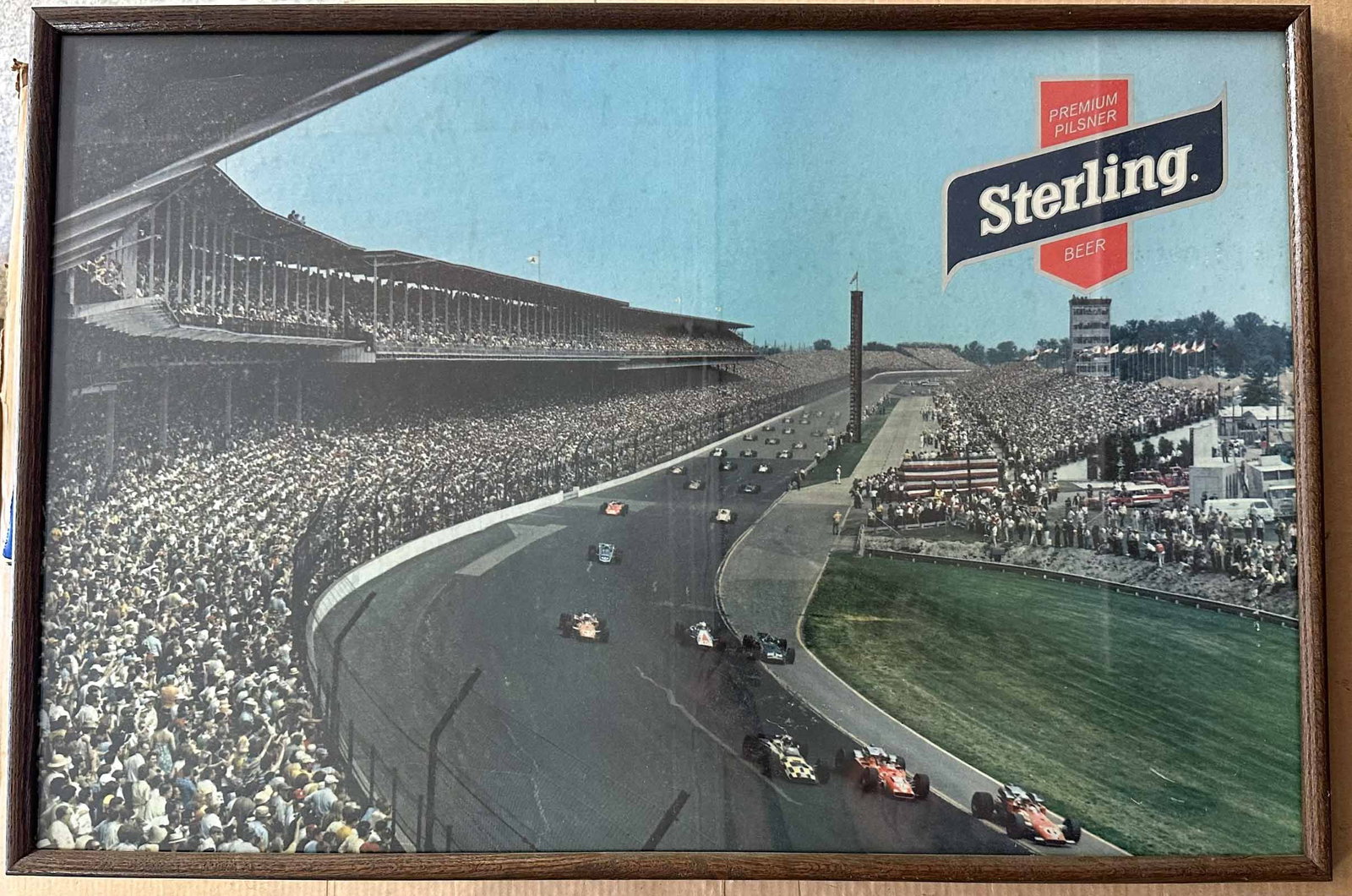 Sterling Beer Poster: 1969 Sterling Beer (Louisville KY) promotional poster showing the start of the 1969 Indy 500, front row front left to right, Bobby Unser (finished 3rd), Mario Andretti (winner), A J Foyt (8th), 30 x