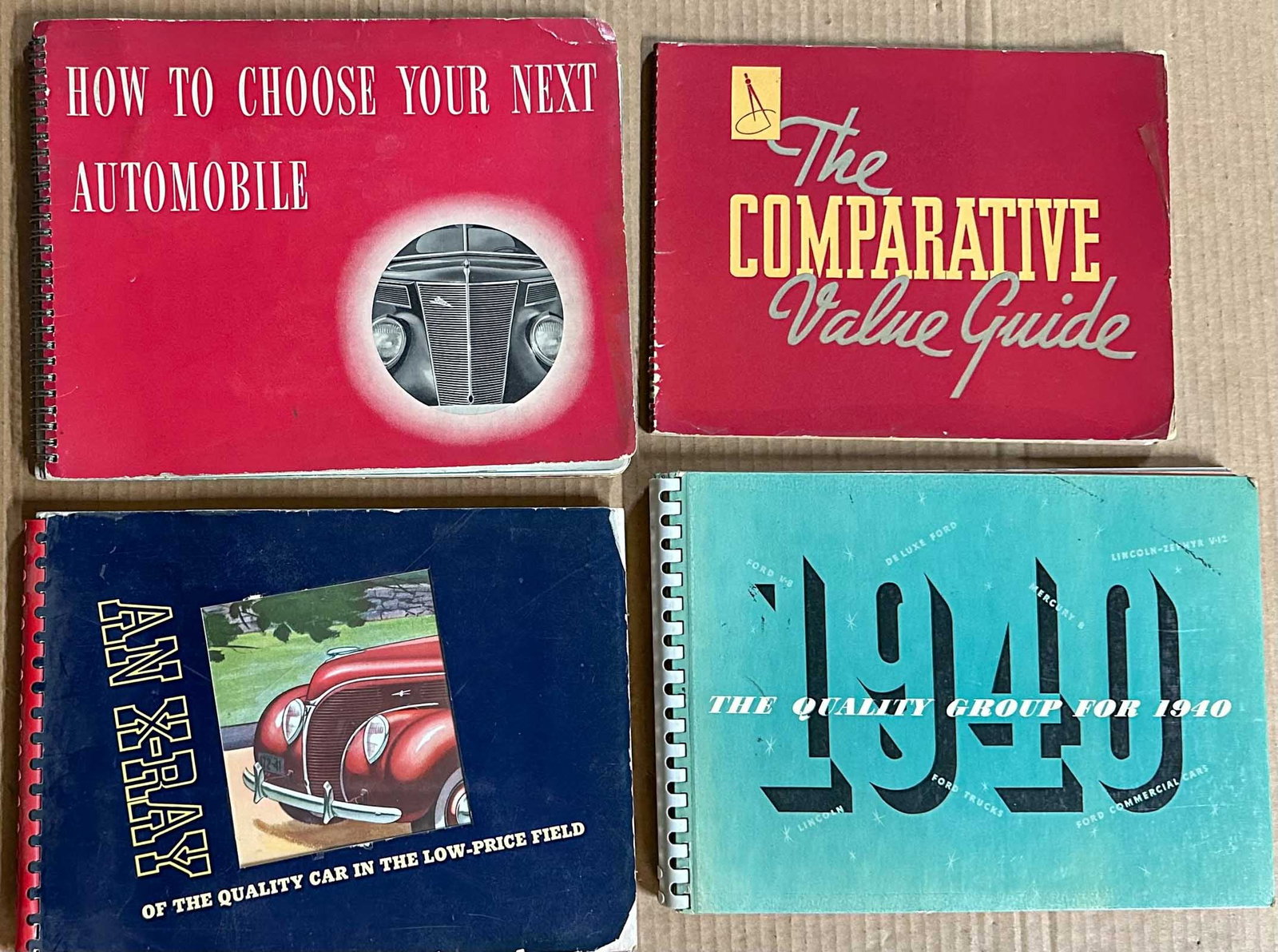 Ford Lot: Four Ford V 8 dealers albums - 1937 Comparative values with competition, 1937 Passenger, 1938 Passenger (a few water damaged pages) 1940 Ford full line, Ford, Mercury Lincoln, truck, 60 to 120 pgs