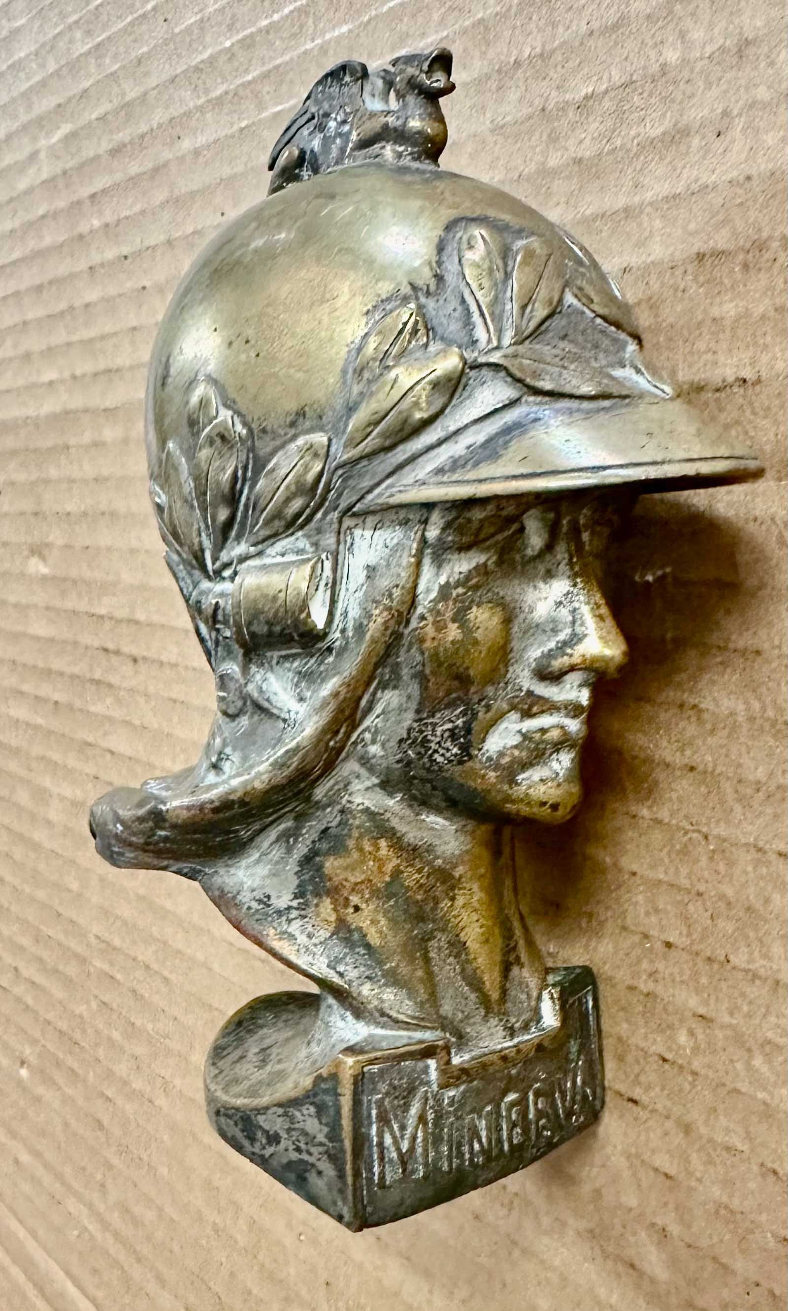 Mascot: 1925 - 1927 Minerva bronze mascot with griffin on helmet, Williams #286.