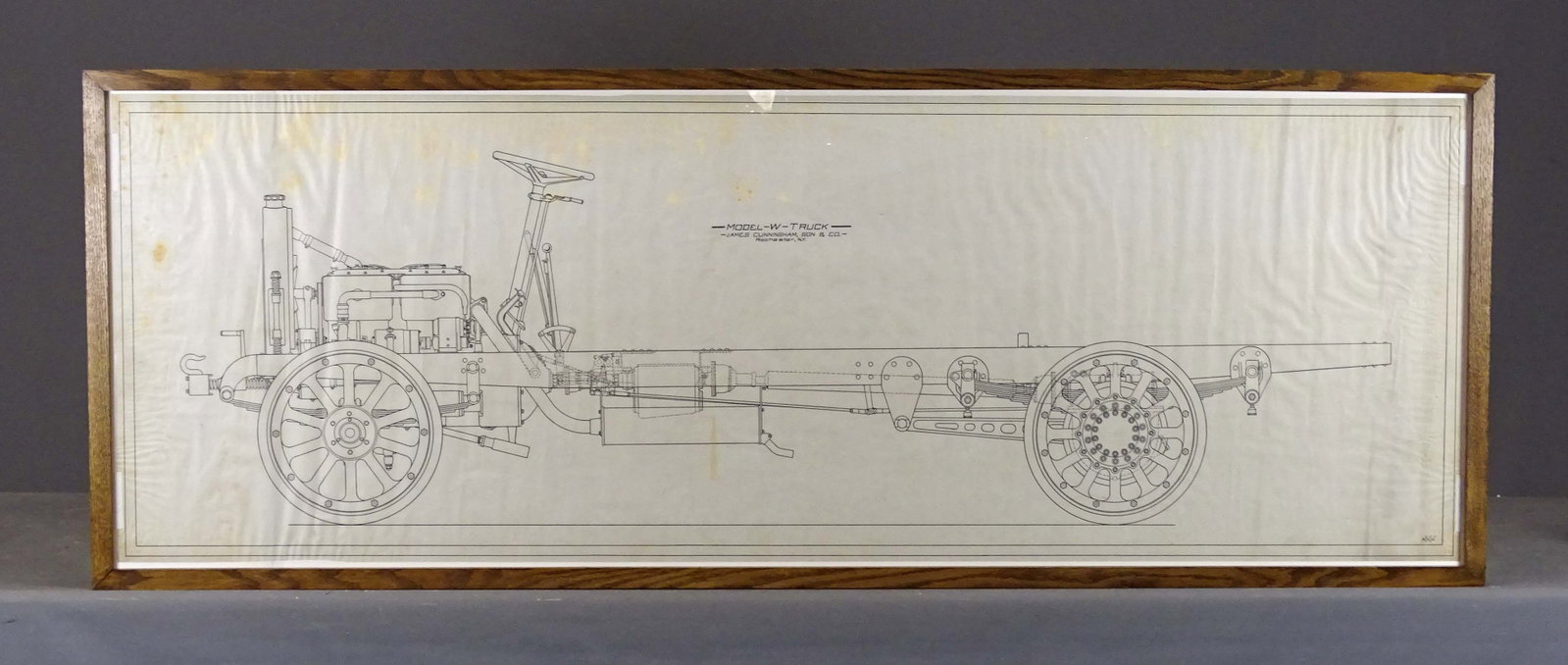 Framed Chassis Drawing: Original chassis drawing, "Model-W-Truck, James Cunningham, Son & C.o. Rochester, NY". Artist signed "H.H.H.". Frame 25 1/2" x 68 1/2".