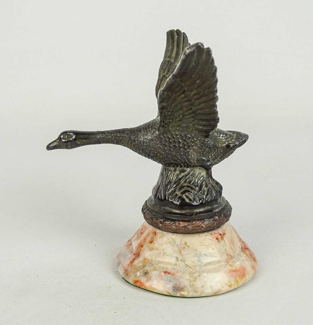 1920's Flying Goose Radiator Mascot: 1920's Flying Goose radiator mascot mounted on marble base. 5" Ht..