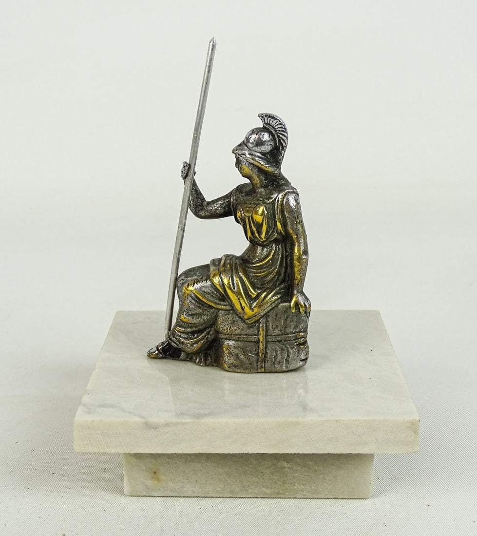 1913 Britannia Radiator Mascot: 1913 Britannia Radiator mascot on quartz base. Nickel plated brass (spear not original). 5 1/2" Ht..