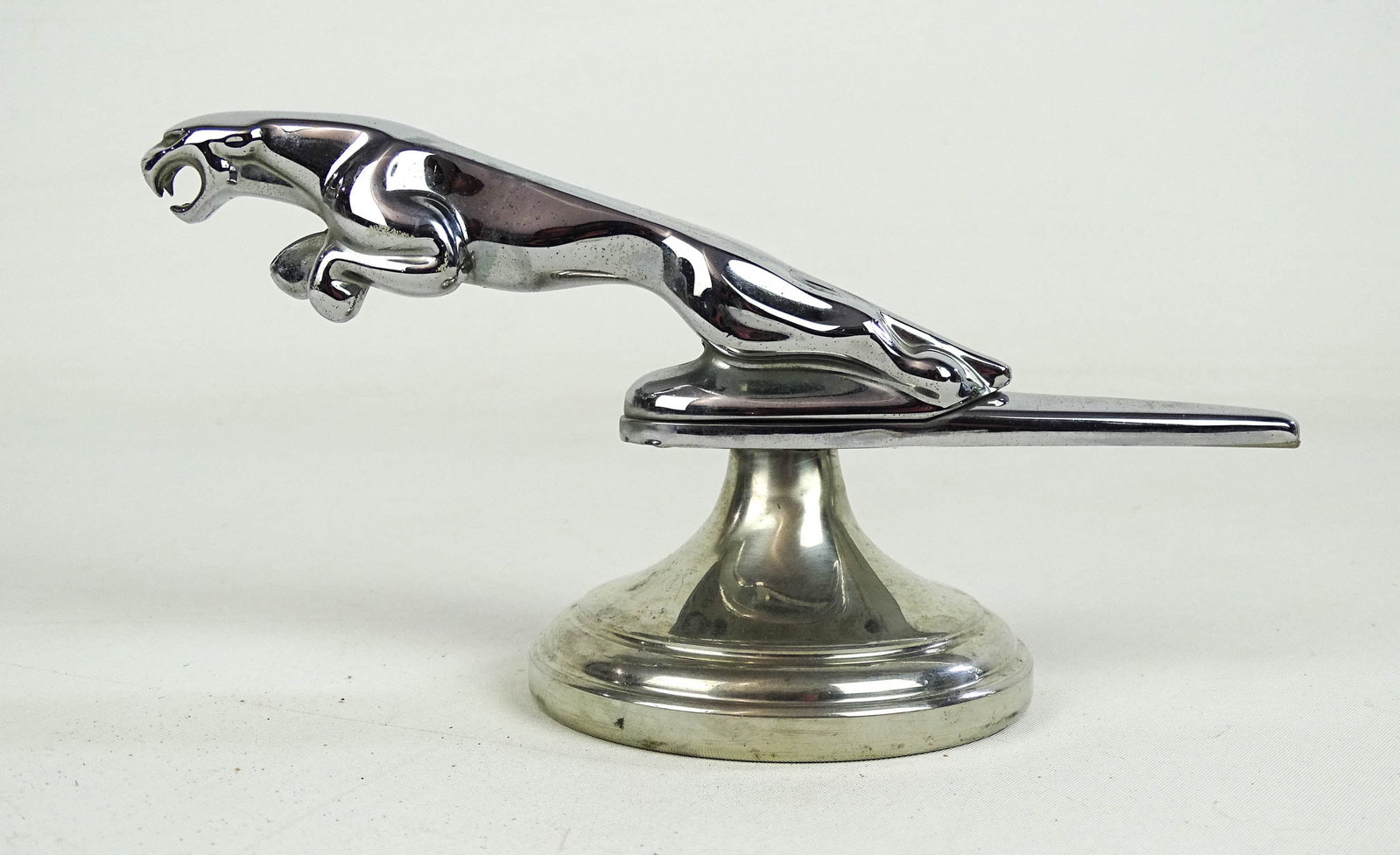 Vintage Jaguar Hood Ornament: Vintage Jaguar "Leaper" hood ornament on matching chromed stand. 4" Ht..