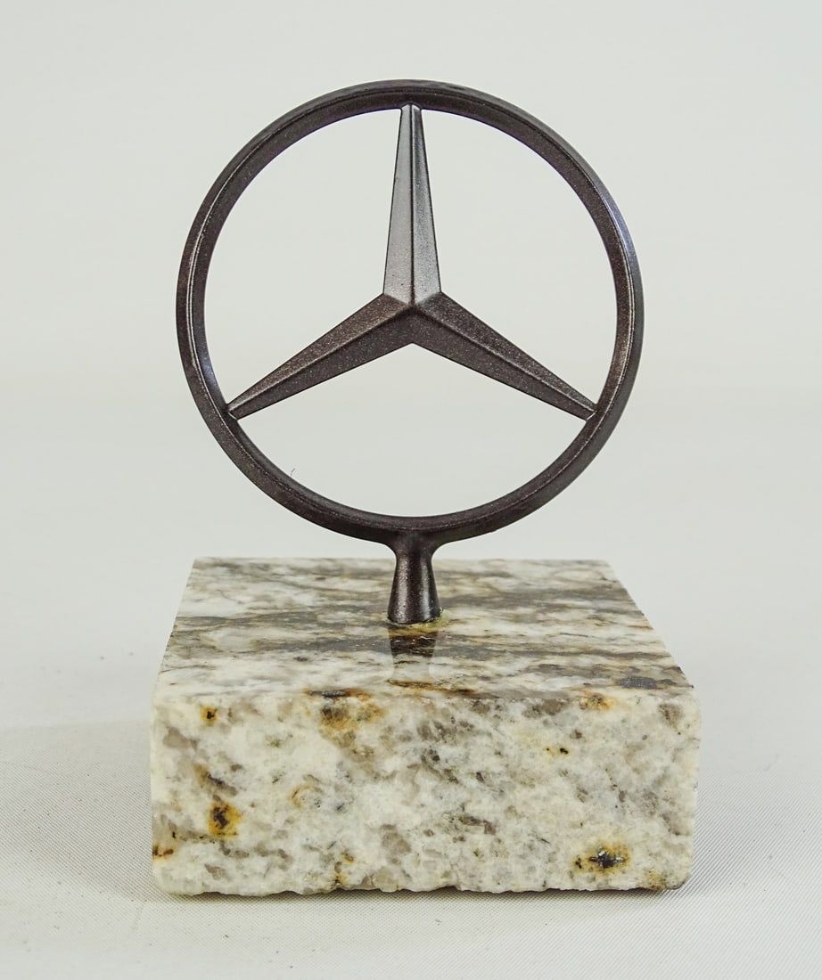 Vintage Mercedes Hood Ornament: Vintage Mercedes Star hood ornament on granite base. 4 3/4" Ht..