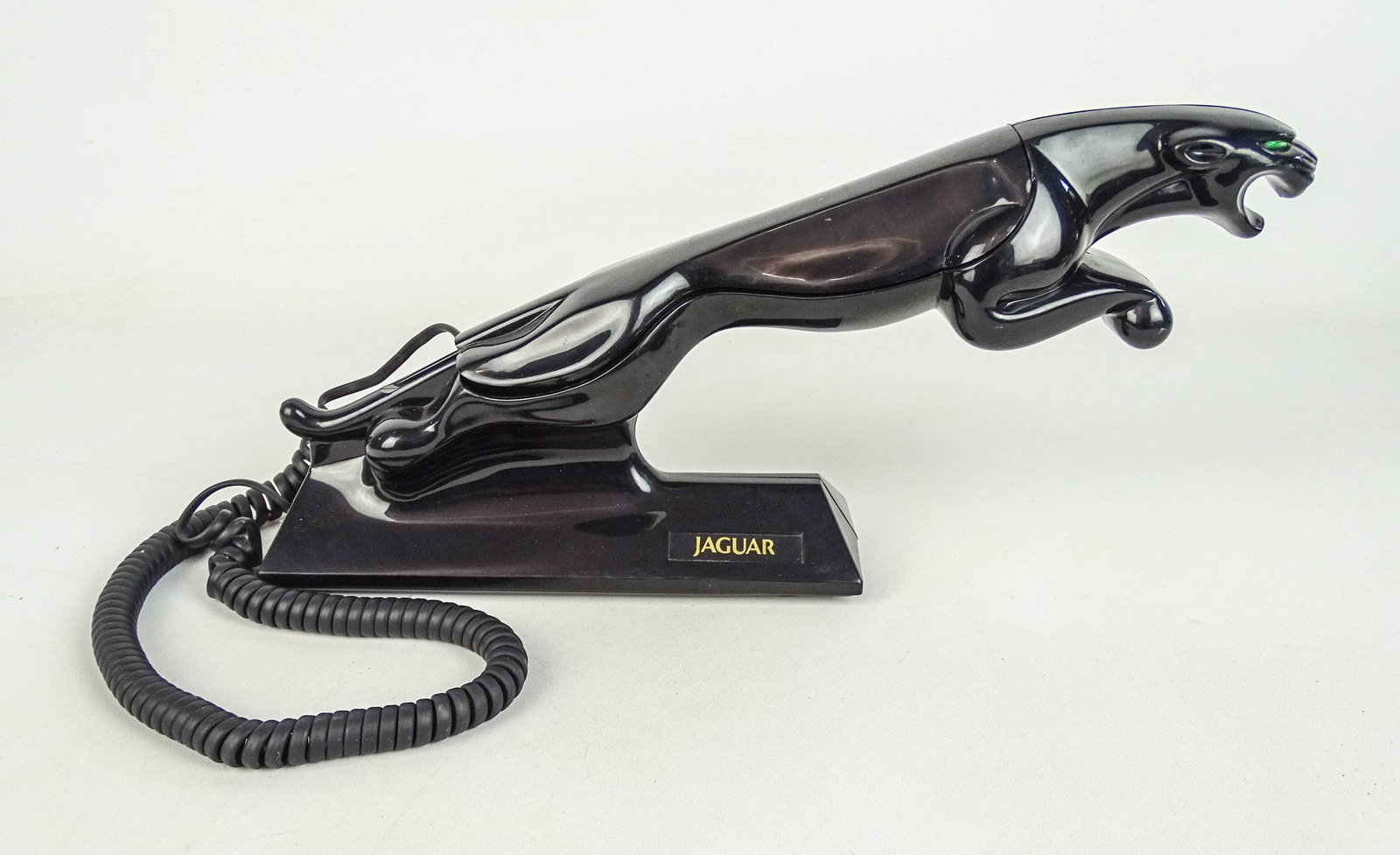 Jaguar Telephone: 1980 Kash N Gold Ltd. Jaguar Leaper telephone. Model 7050. Originally marketed as a car dealership premium. Green eyes light up red when ringing. Working condition. Uses standard modern landline