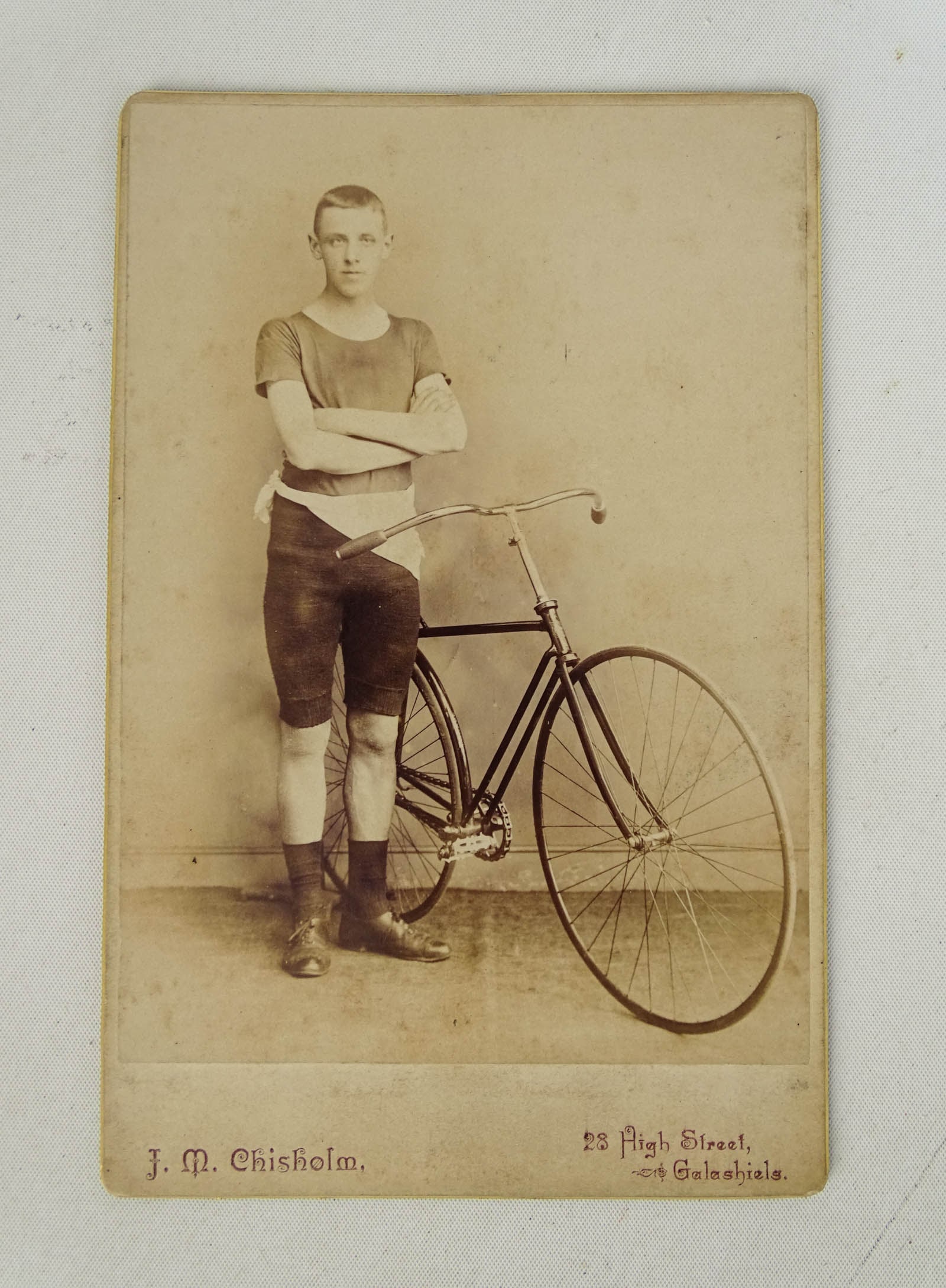 Safety Racer Photo: Photograph: Racer posing with racing hard tire safety circa 1890 - rare image. Good condition. Glenn Eames Collection Burlington Vermont.