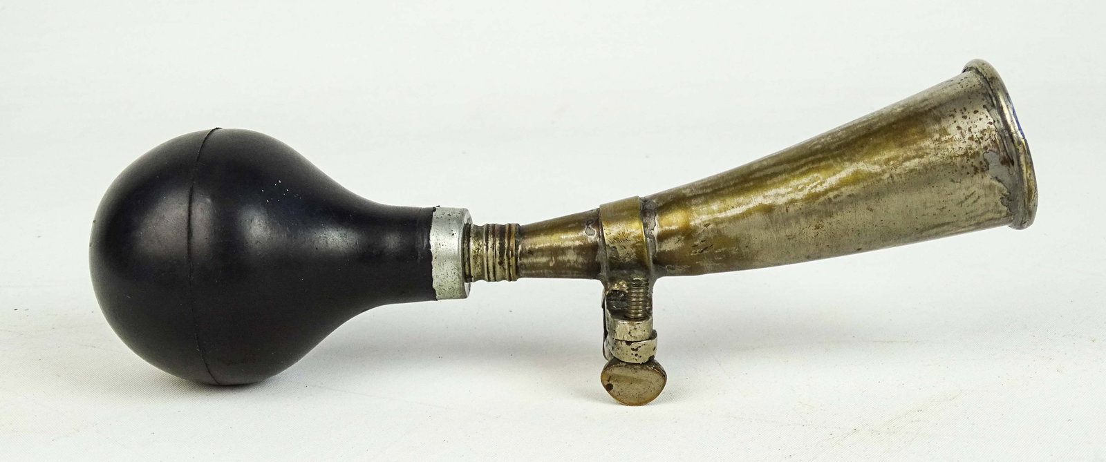 Antique Bulb Horn: 1890's bulb horn for early pneumatic safety bicycle. Possibly sold by Spaulding - unmarked - new rubber bulb works heavy nickel brass. Good condition. Glenn Eames Collection Burlington Vermont.