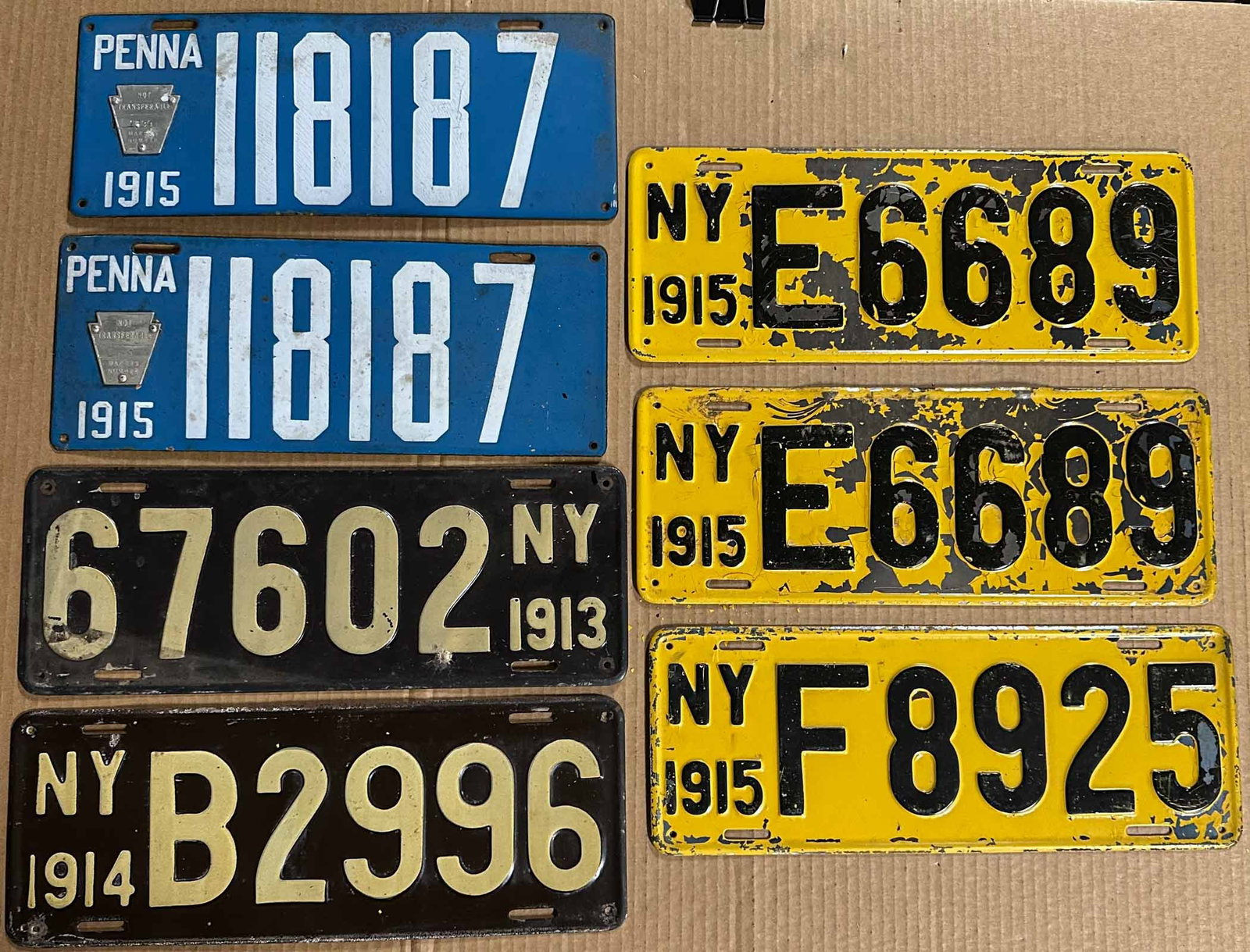 License Plates: Pennsylvania porcelain 1915 pair #181187, New York painted, 1913, 1914, three 1915 (flaking paint).