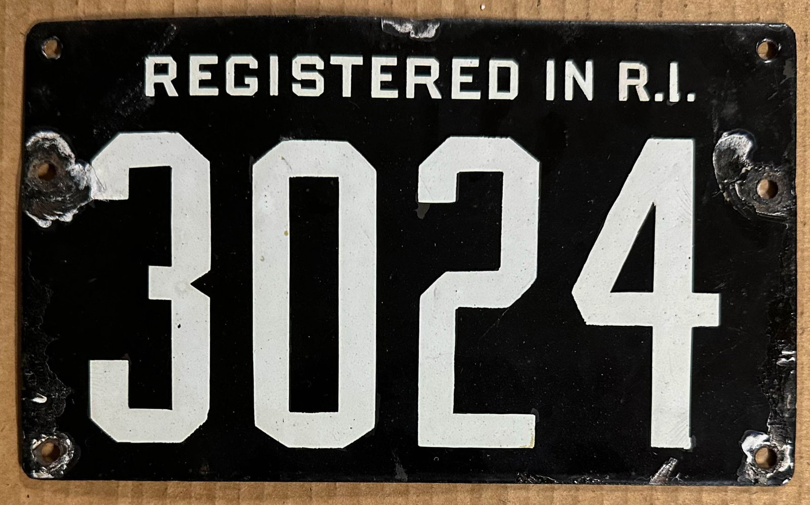 License Plates: Registered In R. I. porcelain license plate, ca 1904 - 1907, #3024.