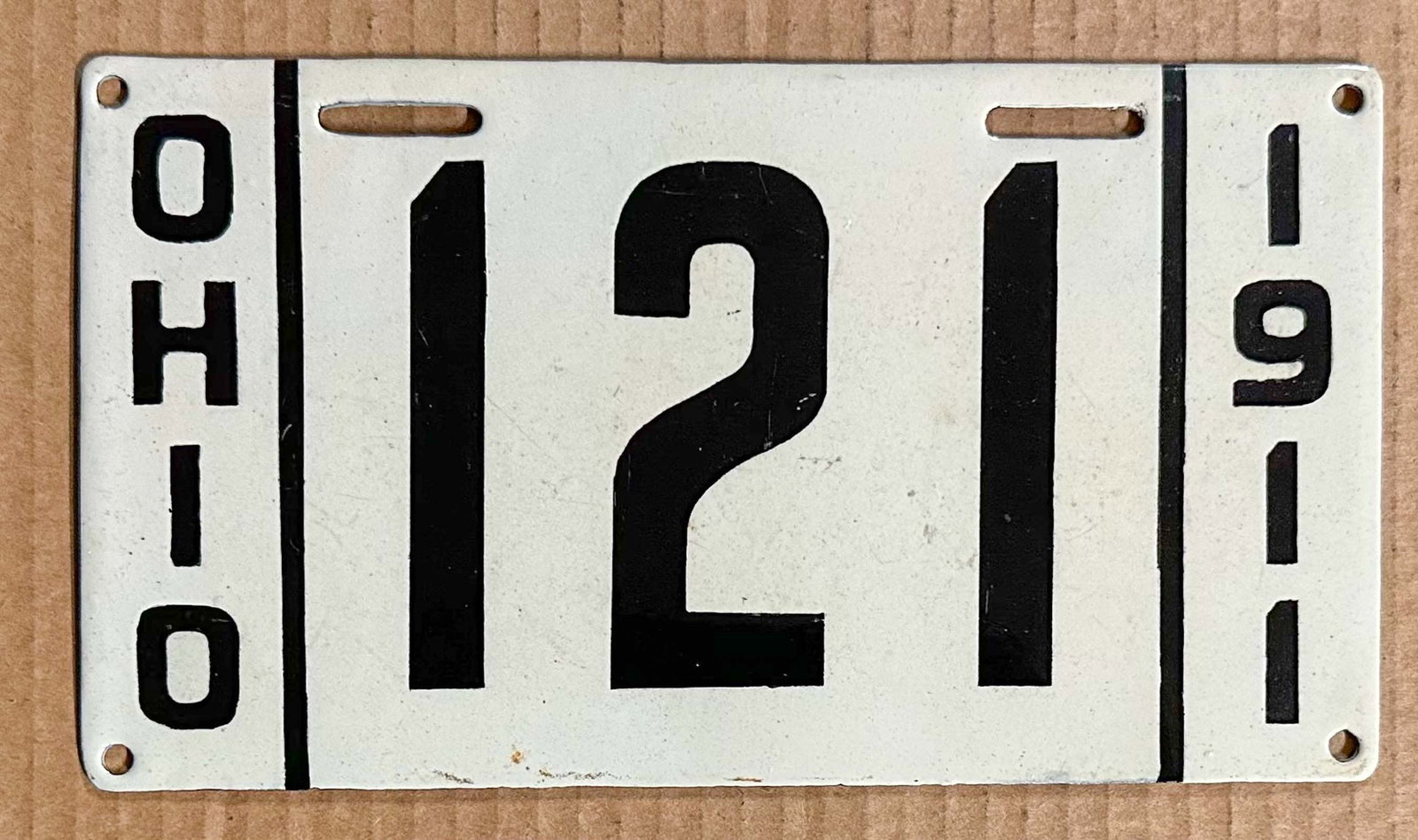 License Plate: 1911 Ohio three digit porcelain license plate, #121.