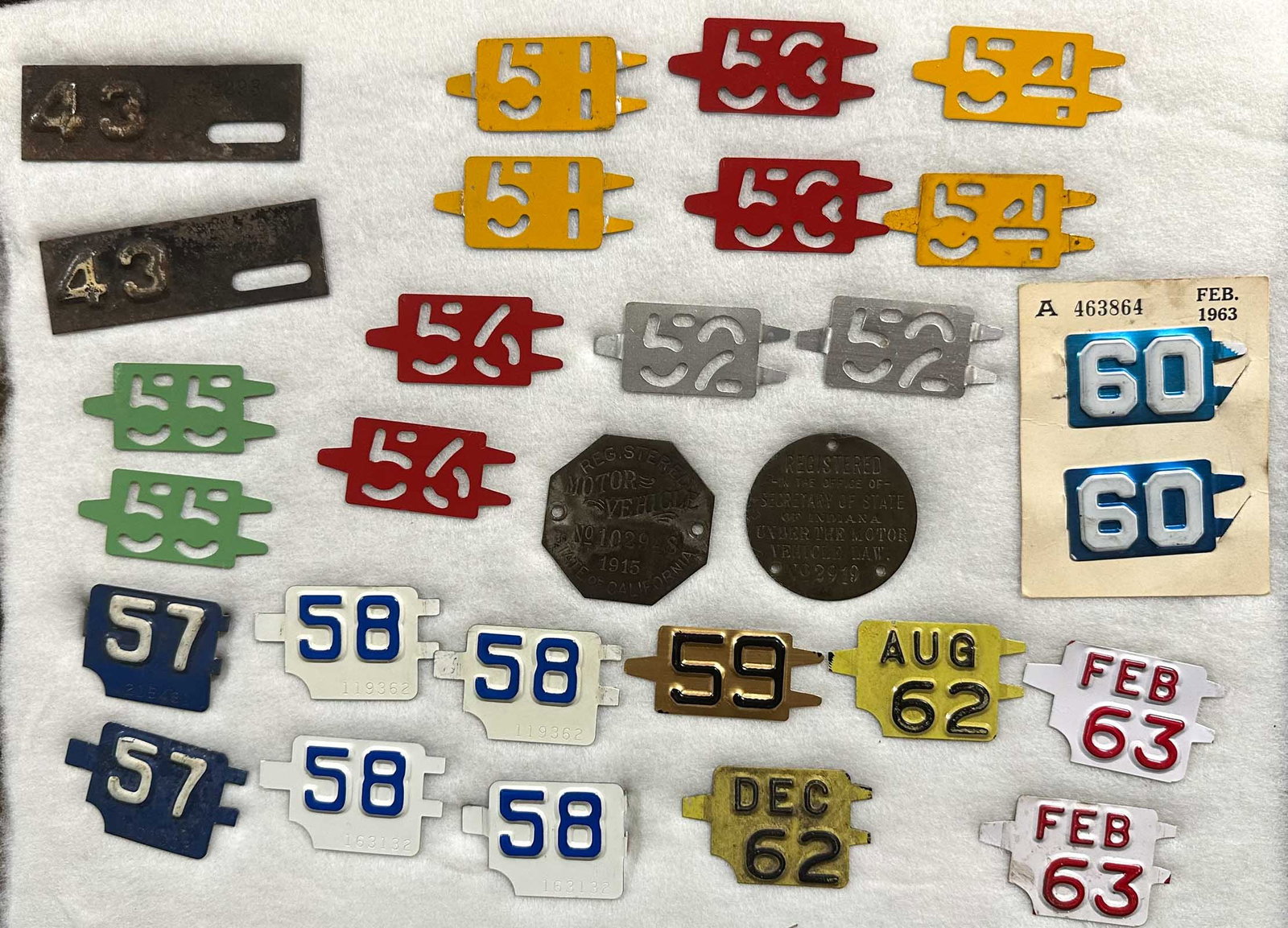 Misc. Lot: License plate and registration related, 1915 California brass octagonal tag, ca teens Indiana Registered, Sec of State round tag, misc Connecticut yearly inserts from 1951-1963.