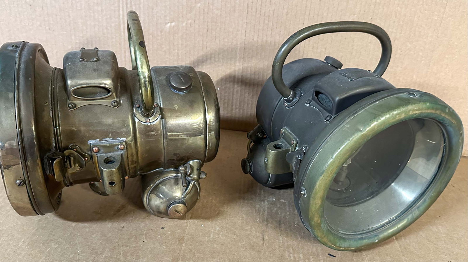 Brass Headlights: Pair of brass self generating headlights, very heavy construction, marked, "Consecutive #287, Reg No 532435", nine inch dia lens, eleven inches long.