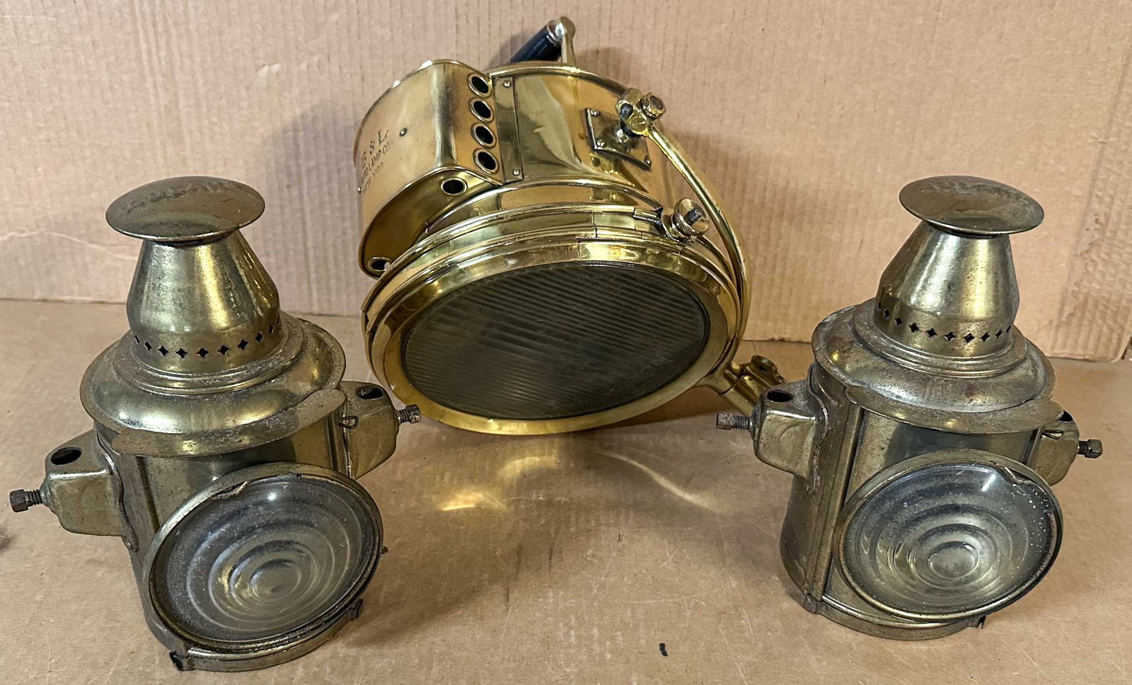 Adlake Sidelights: Pair of Adlake sidelights, brass color plated steel construction (Adlake lights were used on early Mack trucks), 9.5 high and B and L brass searchlight, 9 inch dia..
