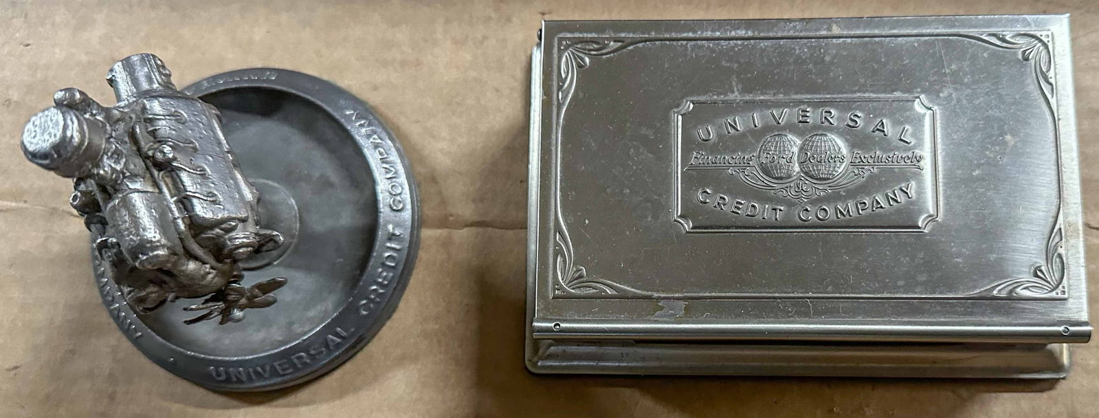 Ford Desk Lot: Two Ford Universal Credit Company desk pieces, ca late 1930's - early 1940's, V 8 engine on base, 3.75 dia (fan blades and air cleaner intact), desk card caddy, 5.5 x 3.75.