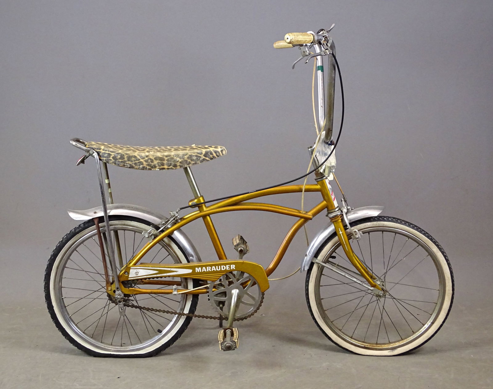 Monark "Marauder" Bicycle: Vintage Monark "Marauder" bannana seat bicycle. Fair condition. 3-Speed. Good condition.