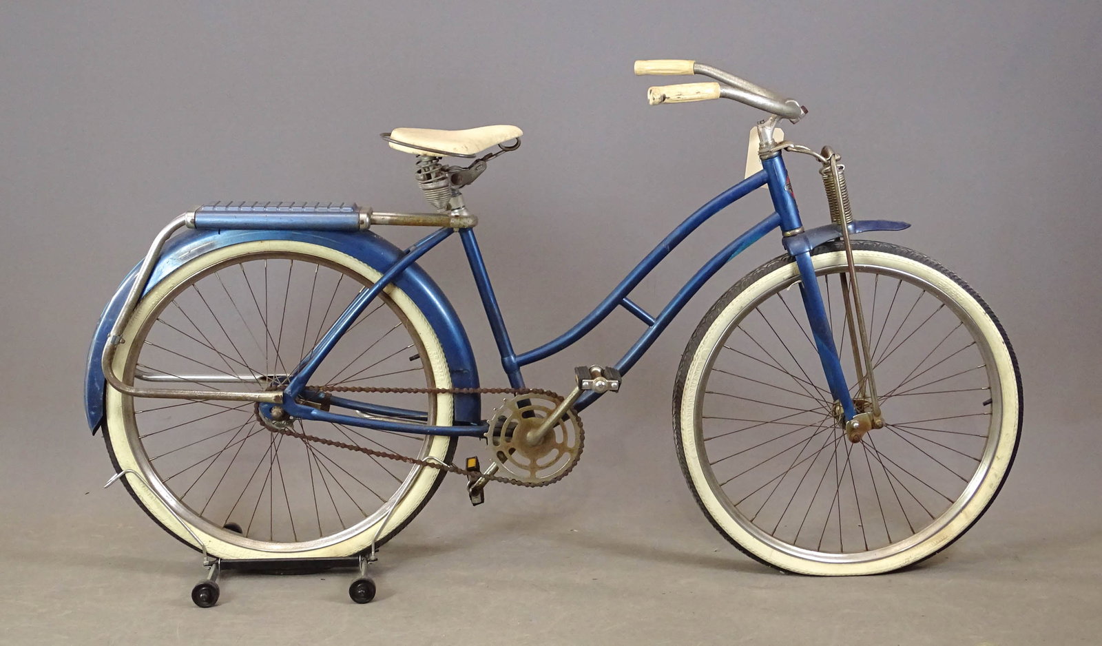 Western Flyer Bicycle: Vintage Western Flyer bicycle. Spring front, rear carrier. White wall tires. 18" frame. Fair condition.