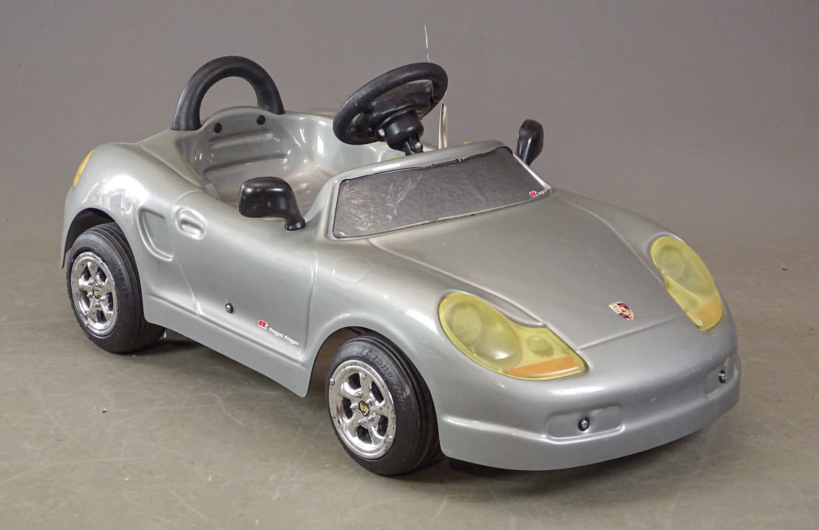 Porsche Boxter Pedal Car: Porsche Boxter pedal car. Marked "Toys Toys". Fair condition. 39" L..