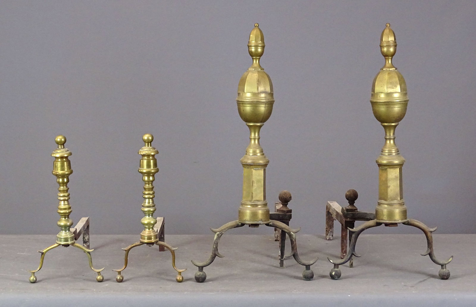 Andiron Lot: Lot (2) pair of early andirons including: Brass figural (23" Ht., 24" D.), pair brass steepletop (22" Ht., 20" D.).