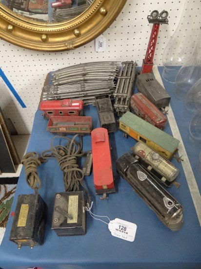 Marx And Lionel Trains: Lot of Marx pre war train set New York Central" includes (6) pcs. and transformer, (3) Lionel pre war cars and a type 1029 transformer, misc. track and signal tower."