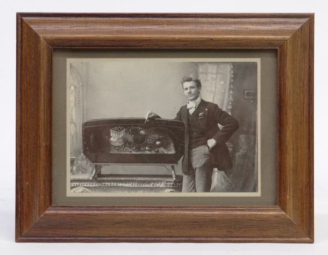 Occupational Photograph: Early occupational albumen photo of artist posed with painting. Image 4 x 5 1/2". Prov. Joel & Kate Kopp collection."