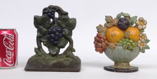 Doorstops: Lot two painted doorstops including urn with flowers (7 Ht.) and grape clusters marked "Albany FDYD", 8" Ht.."