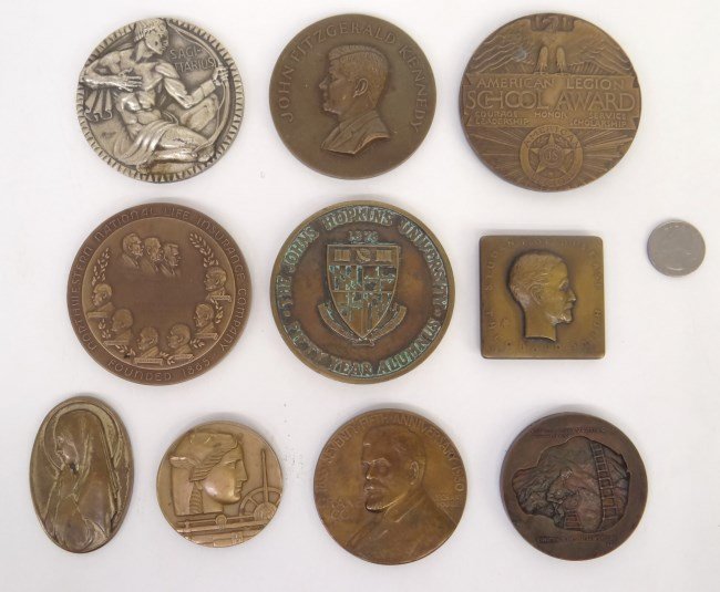 Lot of (10) Assorted Medallions: Lot of (10) assorted Medallions and paper weights including: John Kennedy, Johns Hopkins fifty year alumnus, Exposition to the Judean Desert Caves, Medallic Art Co anniversary coin, Northwestern Life 