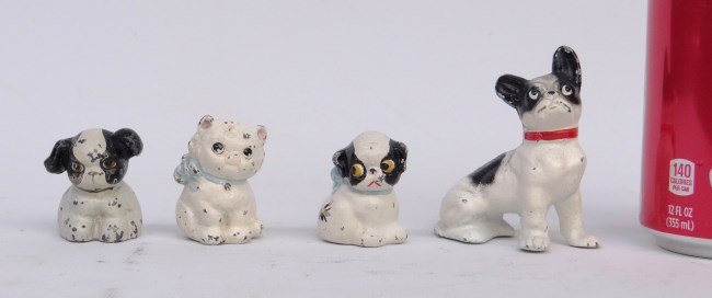 Hubley Paperweights: Four cast iron Hubley paperweight dogs.