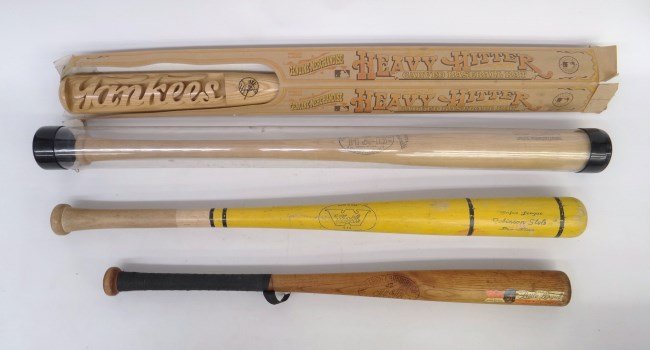 Baseball Bat Lot: Lot four various baseball bats including boxed Yankees Heavy Hitter", "Worth Robinson Style", "Hillerich & Bradsby Grand Slam Jackie Robinson Model", "Hillerich & Bradsby Little League Jackie Robinson