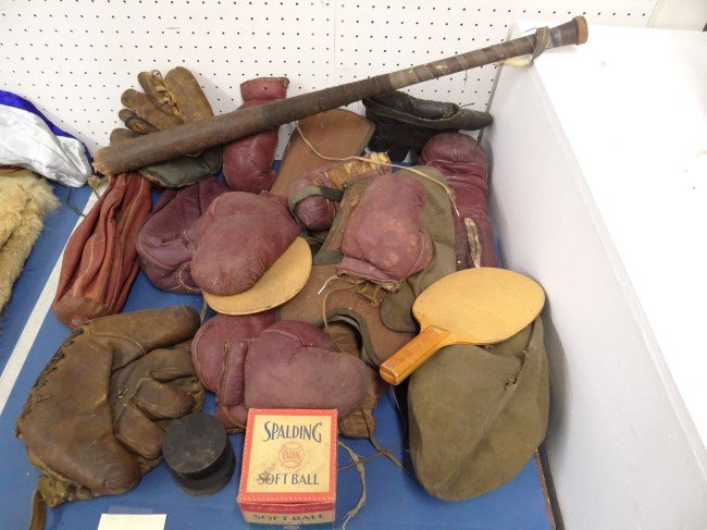 Sports Lot: Lot misc. sports items including gloves, Spaulding softball, football, boxing gloves etc.