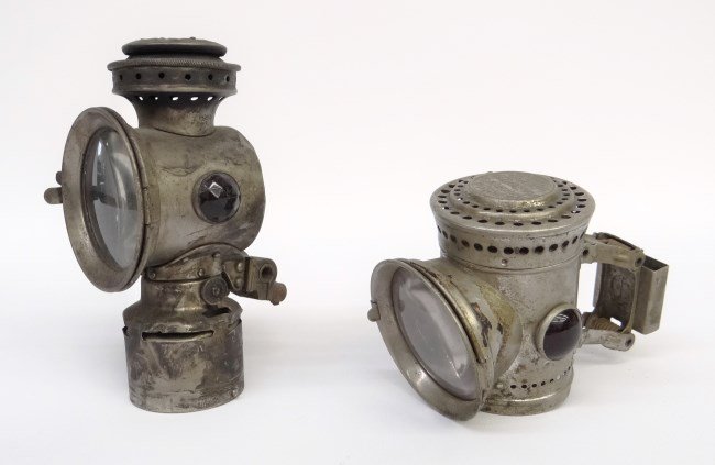 Lot of (2) Bicycle Lamps: Lot of (2) bicycle lamps, one Place & Terry Mfg., Co. Searcher with bracket missing base, Rose Mfg. Co., Philadelphia, The Neverout with bracket. Fair condition.