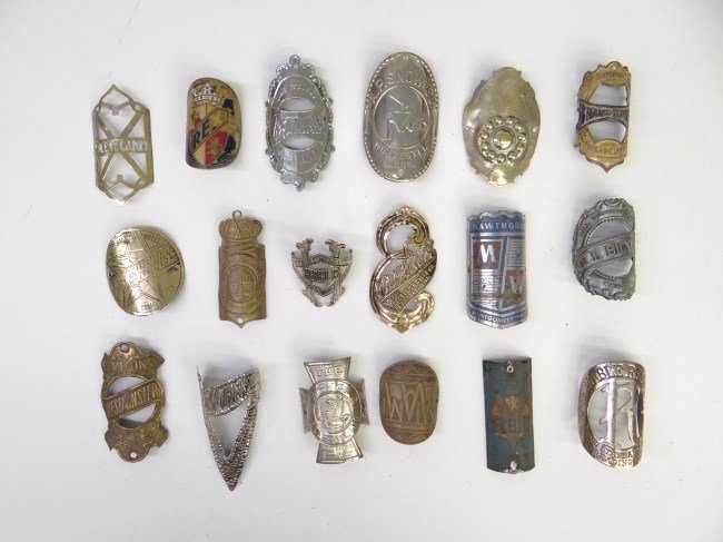 Bicycle Headbadge Collection: Collection of 18 bicycle headbadges including Hawthorne, Cleveland, Excelsior, Simmons, A.P. Snow Co. etc., good condition.