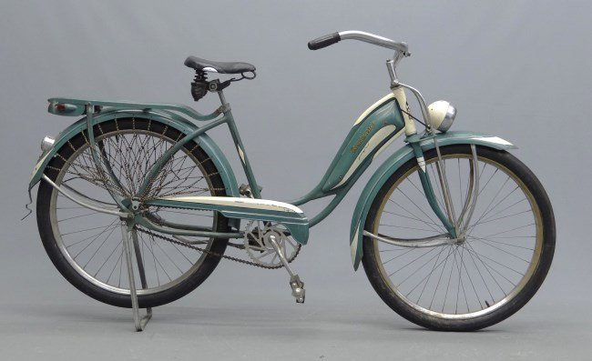 c. 1940's Roadmaster Female Balloon Bicycle: c. 1940's Roadmaster female balloon bicycle. Front and rear lamps, appears very original, good paint, illuminated rear rack, matching tires. Good condition.