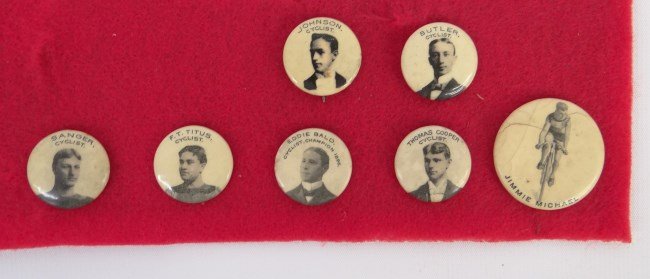 Bicycle Makers Buttons: Lot of (7) bicycle makers buttons featuring cycling racers Jimmie Michael, Butler, Johnson, Titus etc. Good condition.