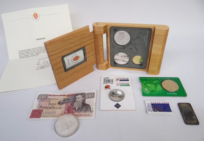 Bicycle Coin Lot: Lot including 1993 World Cycling Championship boxed coins certificate (2 silver coins face value of NOK 100 and one in gold with a face value of NOK 1500), $10.00 1976 Montreal coin, 1 troy ounce 1978