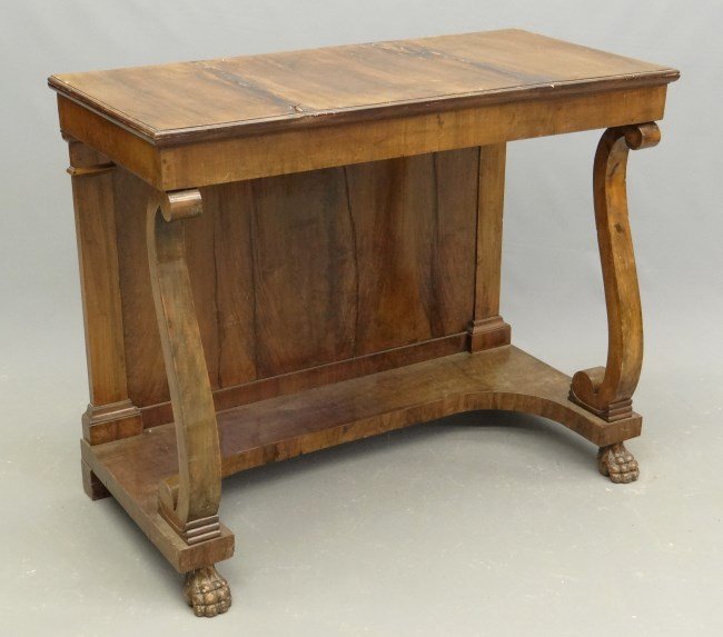 19th c. Pier Table: 19th c. English pier table with rolled columns and paw feet. Veneer damage to top. 47 x 22" x 38"."