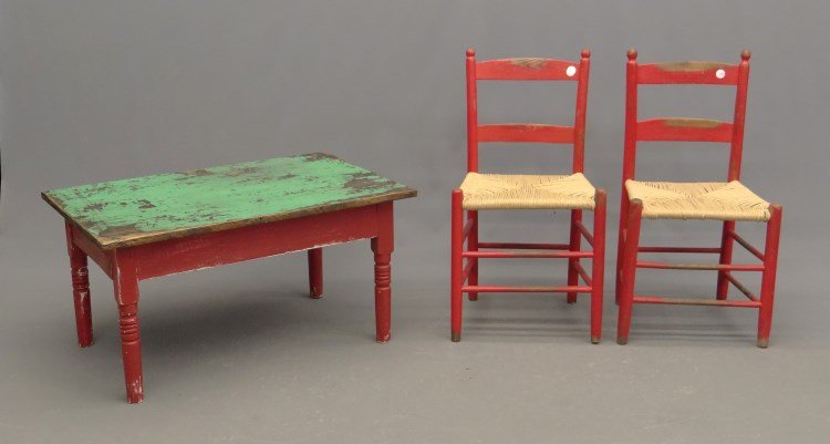 Child's Table And Chairs: Primitive child's table in red and green paint. 35 x 22 1/2" x 18", along with two chairs in red paint."