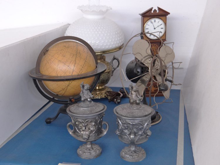 Misc. Lot: Misc. lot including vintage cast iron base globe, fan, oil lamp, miniature inlaid grandfather clock, pewter urns.