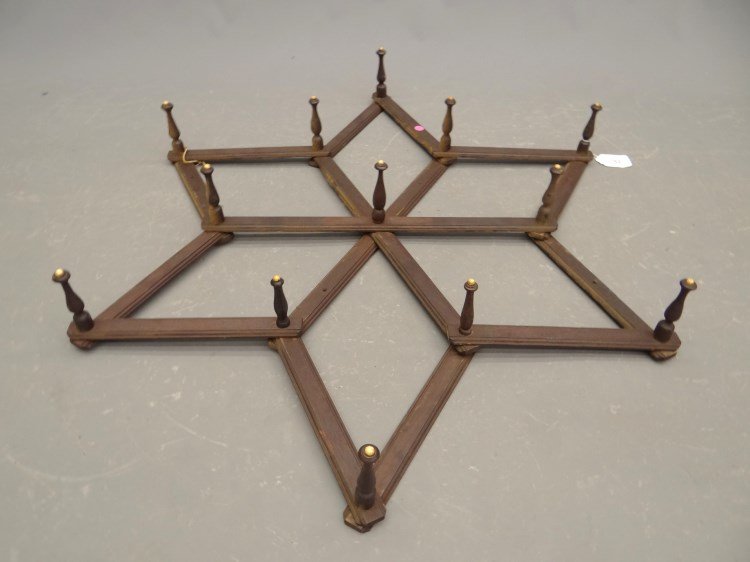 Folding Victorian Rack: Folding Victorian wall rack. 47 length."