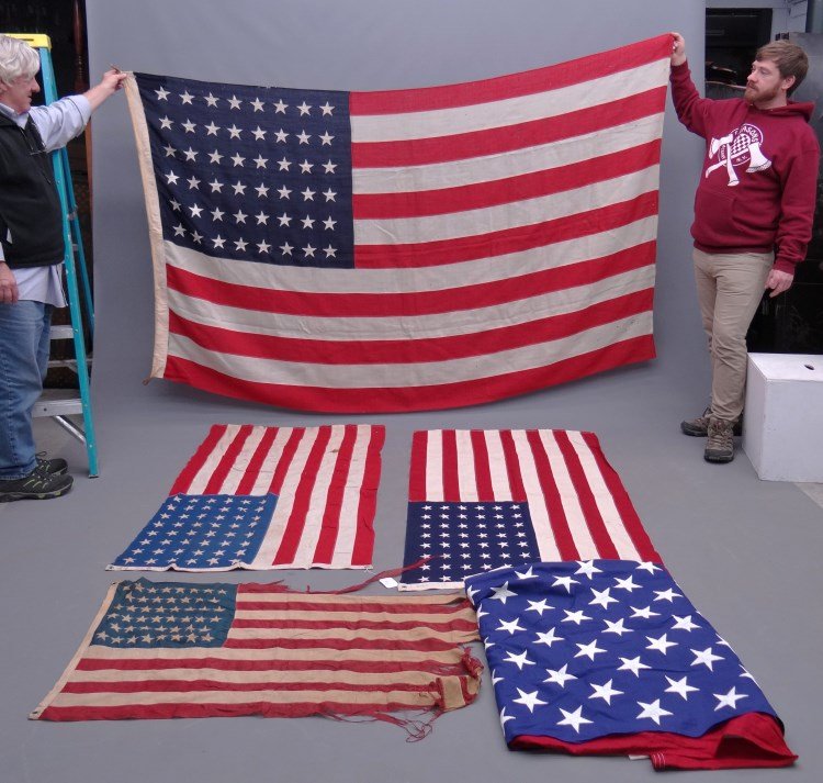 American Flag Lot: Lot of five various American flags including 48 star etc. some as found.