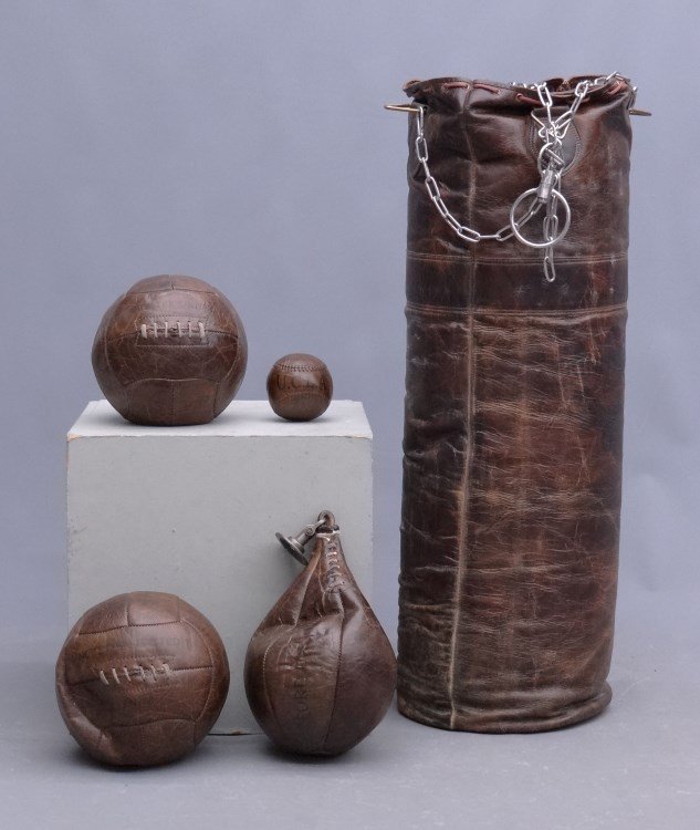 Speed Bag Lot: Lot including "heavy" and speed bag(s), (one large, one small) and two Manchester United balls along with U.C.L.A. ball.