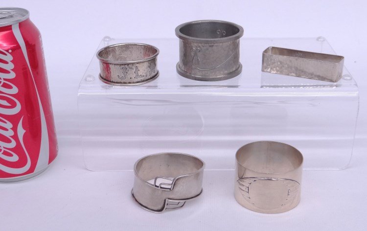 Napkin Rings: Lot five napkin rings including some sterling.