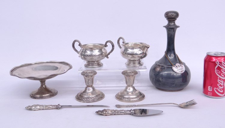 Sterling Silver Lot: Sterling silver lot including decanter (306 grams), along with weighted candlesticks, weighted cream and sugar, weighted compote and boxed cutlery.