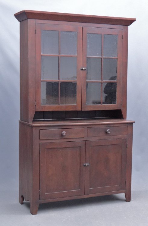 19th c. Stepback Cupboard: 19th c. walnut two part wall cupboard, top having two six pane doors, base with two drawers over two doors. 47 1/2" x 18 1/2" x 81 1/2".
