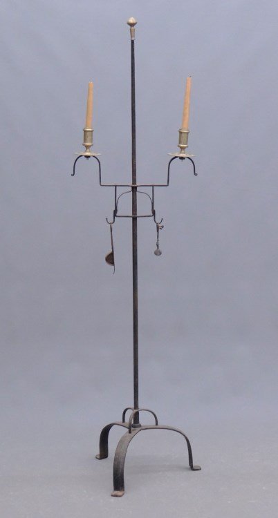 Lighting Device: Wrought iron double brass candle floor standard lighting device with brass finial. 58 1/2" Ht.