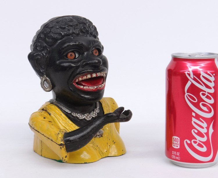 Cast Iron Dinah Bank: Cast iron Dinah bank. 7 Ht."