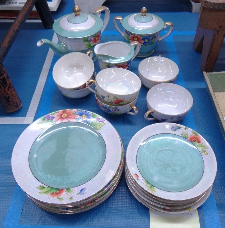 Noritake Tea Set: Noritake teaset for six. Includes six plates, teacups and saucers, teapot cream and sugar.